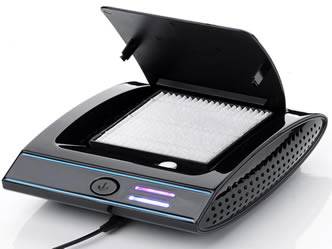 A piece of HEPA filter is installed on a black car air purifier.